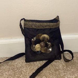 gold and black crossbody with floral detailing